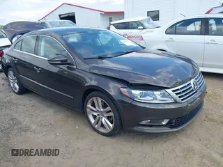2015 Volkswagen CC Executive z VIN WVWRP7AN7FE802238, wystawiony jako IAAI lot #42321727 z przebiegiem 65 933 mil mil oraz . Historia ofert i sprzedaży dostępna na DreamBid. Obrazek 1.