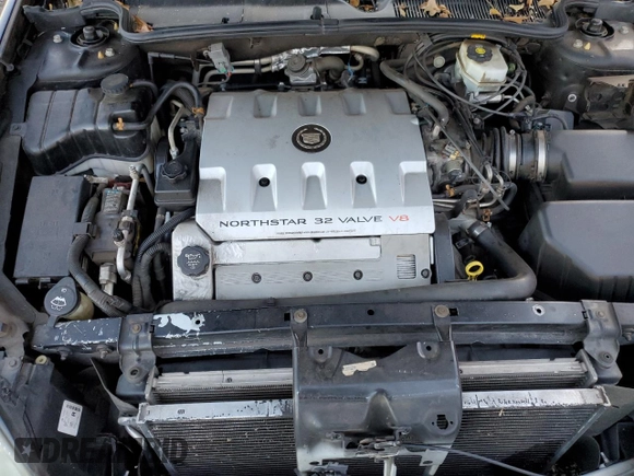 2003 Cadillac DeVille DTS z VIN 1G6KF57963U245281, wystawiony jako Copart lot #79911554 z przebiegiem Nie podano mil oraz Szkody całkowita. Historia ofert i sprzedaży dostępna na DreamBid. Obrazek 11.