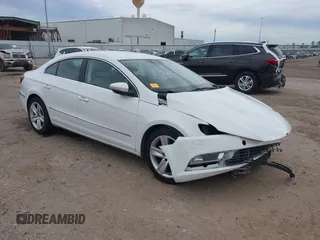 2013 Volkswagen CC Sport with VIN WVWBN7AN0DE553933, listed as a IAAI auction lot 41306575 with 98,134 mi miles and . Bid and sale history available at DreamBid. Image 1.