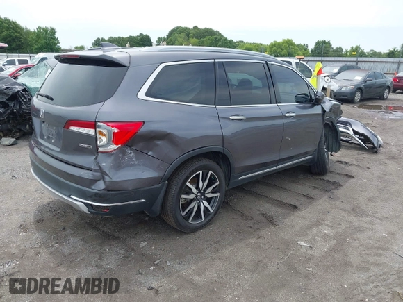 2019 Honda Pilot Touring 8-Passenger with VIN 5FNYF5H93KB028641, listed as a IAAI auction lot 42524078 with 56,744 mi miles and . Bid and sale history available at DreamBid. Image 4.