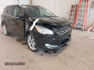 2016 Ford Escape Titanium with VIN 1FMCU0JX3GUB70607, listed as a IAAI auction lot 41727421 with 106,857 mi miles. Bid and sale history available at carsss.com. Image 18.