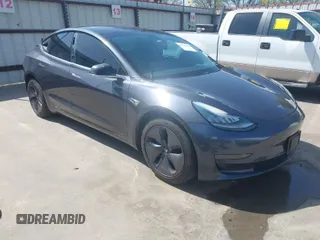 2018 Tesla Model 3 Long Range Battery with VIN 5YJ3E1EA4JF157782, listed as a IAAI auction lot 41774169 with 123,239 mi miles. Bid and sale history available at carsss.com. Image 1.