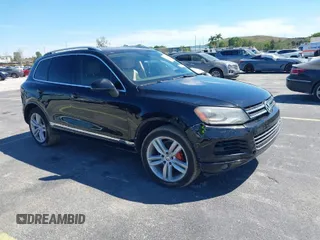2013 Volkswagen Touareg Lux with VIN WVGEF9BP6DD004454, listed as a IAAI auction lot 41862958 with 239,548 mi miles and . Bid and sale history available at DreamBid. Image 1.