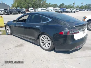 2014 Tesla Model S P85D with VIN 5YJSA1H25EFP65571, listed as a IAAI auction lot 42185442 with 115,990 mi miles and . Bid and sale history available at DreamBid. Image 3.