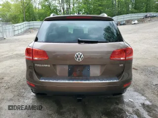 2013 Volkswagen Touareg Exec с VIN WVGEF9BP4DD007109, выставлен на аукционе Copart как лот 58890665 с пробегом 157 286 миль миль и Списание • Salvage title. История ставок и продаж доступна на DreamBid. Изображение 6.