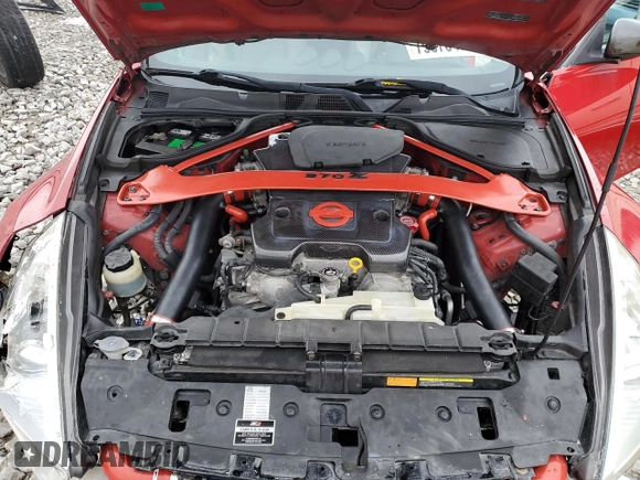 2009 Nissan 370Z z VIN JN1AZ44E19M400603, wystawiony jako Copart lot #79878474 z przebiegiem 129 976 mil mil oraz Szkoda całkowita • Salvage title. Historia ofert i sprzedaży dostępna na DreamBid. Obrazek 11.