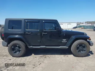 2010 Jeep Wrangler Unlimited Sahara with VIN 1J4HA5H17AL140941, listed as a IAAI auction lot 42004203 with 126,100 mi miles. Bid and sale history available at carsss.com. Image 12.