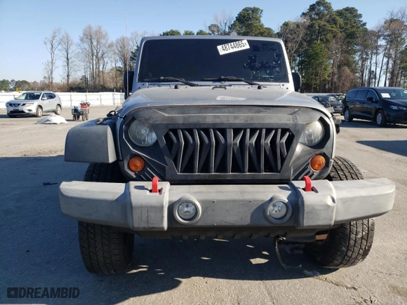 2013 Jeep Wrangler Unlimited Sport with VIN 1C4BJWDG7DL688230, listed as a Copart auction lot 48744865 with 142,110 mi miles and Clean Title. Bid and sale history available at carsss.com. Image 5.