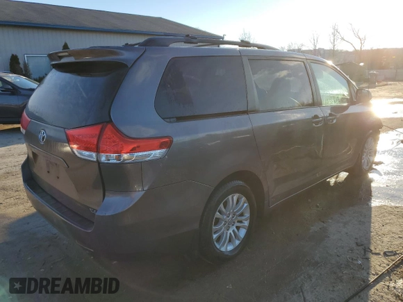 2011 Toyota Sienna XLE AAS with VIN 5TDYK3DC1BS170855, listed as a Copart auction lot 86829904 with 142,117 mi miles and Salvage Title. Bid and sale history available at carsss.com. Image 3.