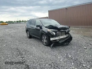 2017 Honda Pilot Touring z VIN 5FNYF6H91HB011030, wystawiony jako Copart lot #60236875 z przebiegiem 119 909 mil mil oraz Szkoda całkowita • Salvage title. Historia ofert i sprzedaży dostępna na DreamBid. Obrazek 14.