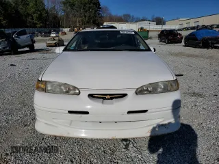 1997 Ford Thunderbird LX with VIN 1FALP62W0VH150654, listed as a Copart auction lot 86274524 with 119,203 mi miles and Salvage Title. Bid and sale history available at DreamBid. Image 5.