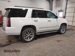 2015 GMC Yukon SLE with VIN 1GKS2AKC6FR103447, listed as a IAAI auction lot 41596220 with 104,209 mi miles. Bid and sale history available at carsss.com. Image 4.