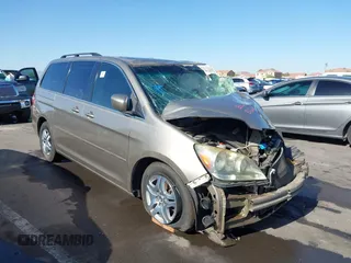2005 Honda Odyssey EX-L z VIN 5FNRL38755B063203, wystawiony jako IAAI lot #41073372 z przebiegiem Nie podano mil oraz . Historia ofert i sprzedaży dostępna na DreamBid. Obrazek 1.