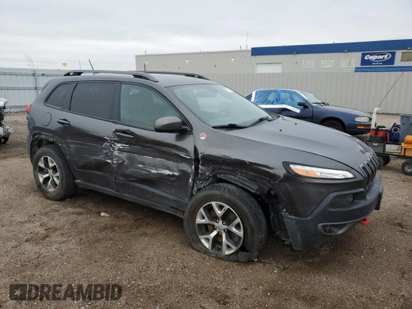 2015 Jeep Cherokee Trailhawk with VIN 1C4PJMBB6FW574108, listed as a Copart auction lot 57798475 with 105,022 mi miles and Salvage title. Bid and sale history available at DreamBid. Image 4.