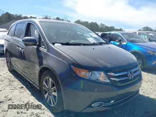2014 Honda Odyssey Touring with VIN 5FNRL5H92EB016546, listed as a IAAI auction lot 41689148 with 143,601 mi miles and . Bid and sale history available at DreamBid. Image 1.