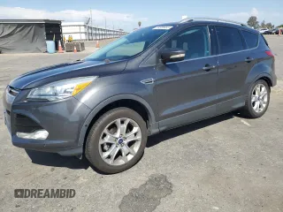 2015 Ford Escape Titanium with VIN 1FMCU0JX6FUB63519, listed as a Copart auction lot 59308855 with 44,764 mi miles and Salvage title. Bid and sale history available at DreamBid. Image 1.