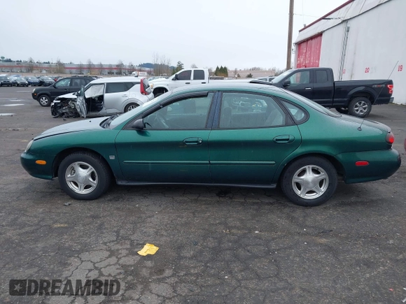 1999 Ford Taurus z VIN 1FAFP52S9XG309250, wystawiony jako IAAI lot #41797222 z przebiegiem 102 676 mil mil oraz . Historia ofert i sprzedaży dostępna na DreamBid. Obrazek 14.