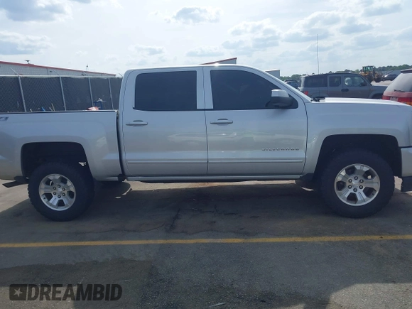 2017 Chevrolet Silverado 1500 LT with VIN 3GCUKREC5HG285689, listed as a IAAI auction lot 42055959 with 128,237 mi miles and . Bid and sale history available at DreamBid. Image 13.