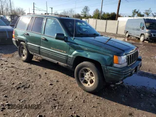 1997 Jeep Grand Cherokee Limited with VIN 1J4GZ78Y2VC728605, listed as a Copart auction lot 83342804 with 104,185 mi miles and Salvage Title. Bid and sale history available at carsss.com. Image 4.