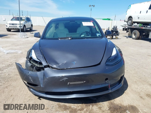 2023 Tesla Model 3 with VIN 5YJ3E1EAXPF617388, listed as a IAAI auction lot 42218748 with Not provided miles and . Bid and sale history available at DreamBid. Image 12.