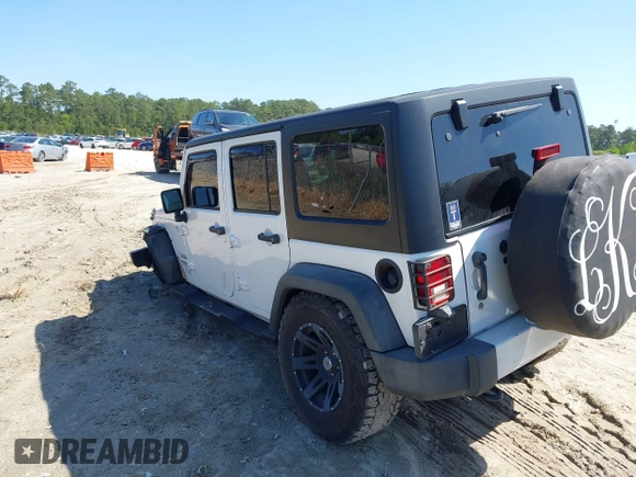 2015 Jeep Wrangler Unlimited Willys Wheeler with VIN 1C4BJWDG0FL546000, listed as a IAAI auction lot 41984566 with 112,742 mi miles and . Bid and sale history available at DreamBid. Image 3.