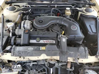1992 Cadillac Seville z VIN 1G6KS53B0NU837105, wystawiony jako Copart lot #55865205 z przebiegiem 94 740 mil mil oraz Szkody całkowita. Historia ofert i sprzedaży dostępna na DreamBid. Obrazek 11.