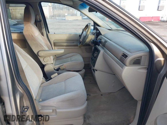 2005 Ford Freestar SE z VIN 2FMZA51645BA05742, wystawiony jako IAAI lot #41429194 z przebiegiem 145 415 mil mil oraz . Historia ofert i sprzedaży dostępna na DreamBid. Obrazek 5.