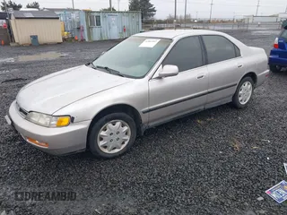 1997 Honda Accord LX with VIN 1HGCD5636VA237594, listed as a IAAI auction lot 41802597 with 215,782 mi miles and . Bid and sale history available at carsss.com. Image 2.