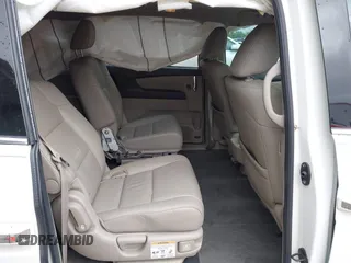 2014 Honda Odyssey Touring with VIN 5FNRL5H95EB059729, listed as a IAAI auction lot 42148110 with 135,304 mi miles and . Bid and sale history available at DreamBid. Image 8.