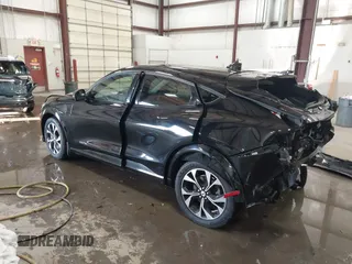2021 Ford Mustang Mach-E Premium z VIN 3FMTK3SU7MMA04683, wystawiony jako IAAI lot #41605693 z przebiegiem 56 801 mil mil oraz . Historia ofert i sprzedaży dostępna na DreamBid. Obrazek 3.
