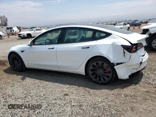 2023 Tesla Model 3 Performance with VIN 5YJ3E1EC5PF487845, listed as a Copart auction lot 62686164 with 4,938 mi miles and Salvage Title. Bid and sale history available at carsss.com. Image 2.