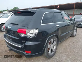2015 Jeep Grand Cherokee High Altitude with VIN 1C4RJFCGXFC604663, listed as a IAAI auction lot 42816306 with 117,467 mi miles and . Bid and sale history available at DreamBid. Image 4.