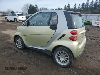 2009 Smart fortwo Pure z VIN WMEEJ31X49K292142, wystawiony jako Copart lot #48928535 z przebiegiem 226 263 mil mil oraz Tytuł czysty. Historia ofert i sprzedaży dostępna na DreamBid. Obrazek 2.