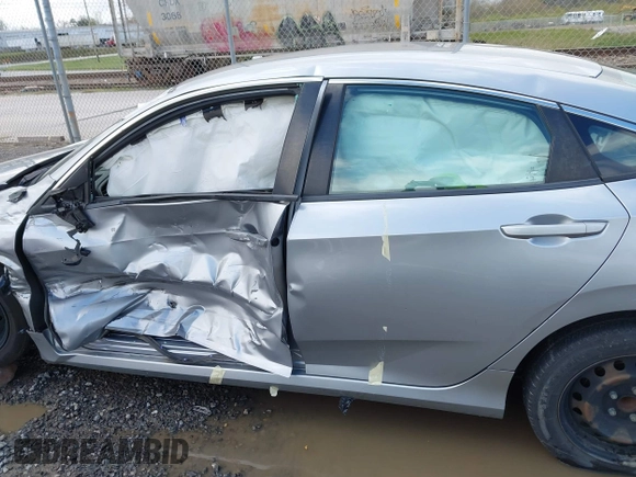 2019 Honda Civic LX with VIN 19XFC2F61KE009471, listed as a IAAI auction lot 42017532 with 81,134 mi miles and . Bid and sale history available at DreamBid. Image 14.