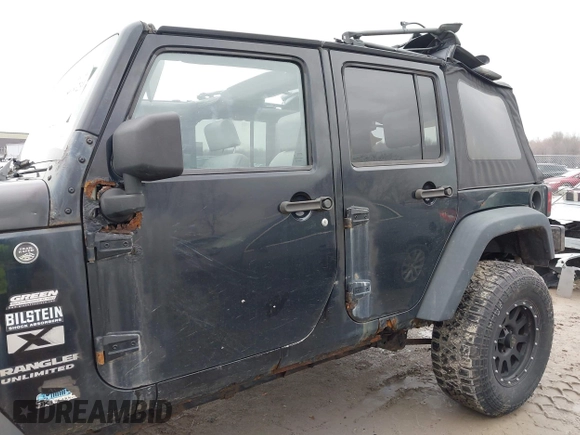 2008 Jeep Wrangler Unlimited X with VIN 1J4GA39138L641138, listed as a IAAI auction lot 41986230 with 215,026 mi miles. Bid and sale history available at carsss.com. Image 15.