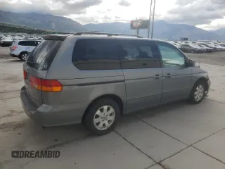 2002 Honda Odyssey EX z VIN 5FNRL18652B014929, wystawiony jako Copart lot #57185775 z przebiegiem 291 807 mil mil oraz Czysty tytuł • Clean title. Historia ofert i sprzedaży dostępna na DreamBid. Obrazek 3.