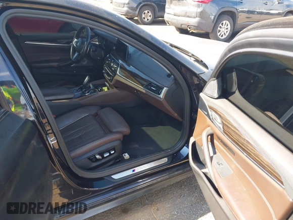 2018 BMW 5 Series M550i xDrive with VIN WBAJB9C55JB286747, listed as a IAAI auction lot 42583106 with 141,102 mi miles and . Bid and sale history available at DreamBid. Image 5.