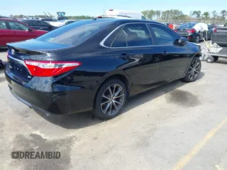 2015 Toyota Camry XLE with VIN 4T1BF1FK0FU908290, listed as a IAAI auction lot 41806103 with 135,533 mi miles and . Bid and sale history available at DreamBid. Image 4.