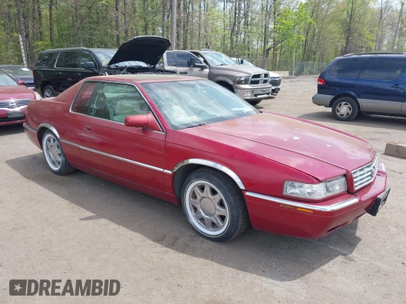 1997 Cadillac Eldorado Touring ETC z VIN 1G6ET1297VU600449, wystawiony jako IAAI lot #42096992 z przebiegiem 185 918 mil mil oraz . Historia ofert i sprzedaży dostępna na DreamBid. Obrazek 1.