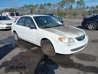 2001 Mazda Protege DX with VIN JM1BJ222010432993, listed as a IAAI auction lot 41454510 with 137,220 mi miles and . Bid and sale history available at DreamBid. Image 1.