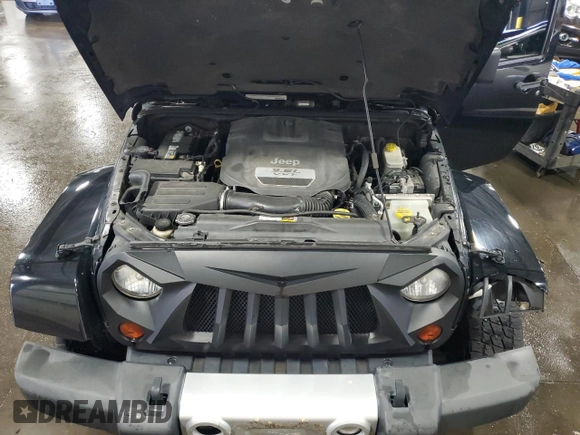 2012 Jeep Wrangler Unlimited Sahara with VIN 1C4BJWEG8CL235893, listed as a Copart auction lot 58195585 with 142,179 mi miles and Salvage title. Bid and sale history available at DreamBid. Image 12.