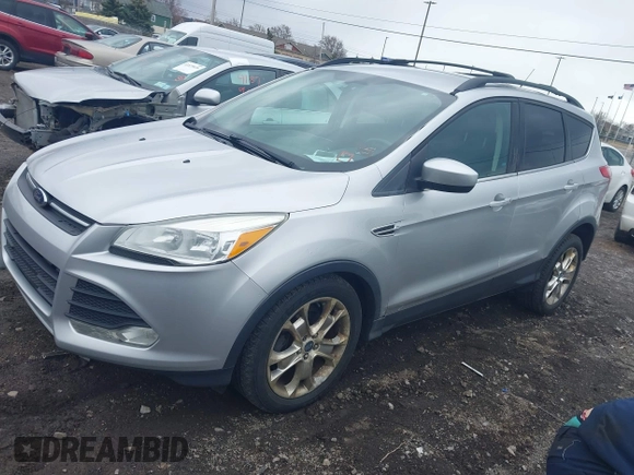 2013 Ford Escape SE with VIN 1FMCU0GX5DUA51847, listed as a IAAI auction lot 41897727 with 115,721 mi miles and . Bid and sale history available at DreamBid. Image 2.