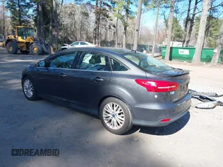 2015 Ford Focus Titanium with VIN 1FADP3J25FL333743, listed as a IAAI auction lot 41857057 with 120,917 mi miles and . Bid and sale history available at carsss.com. Image 3.