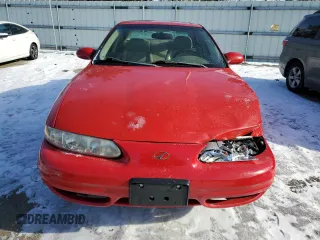2000 Oldsmobile Alero GLS z VIN 1G3NF52E0YC317362, wystawiony jako Copart lot #48044785 z przebiegiem 169 718 mil mil oraz Szkody całkowita. Historia ofert i sprzedaży dostępna na DreamBid. Obrazek 5.
