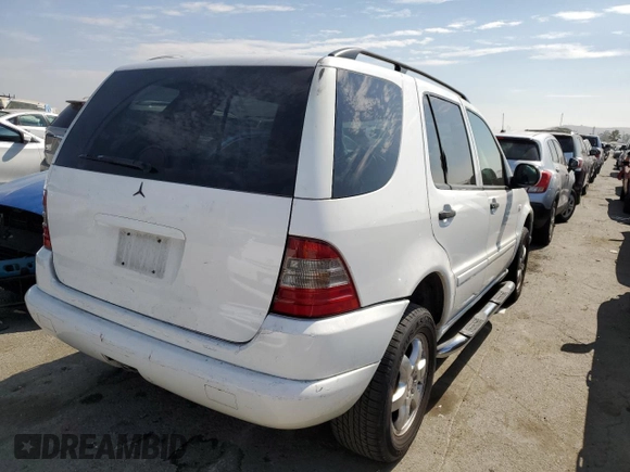 2000 Mercedes-Benz M-Class with VIN 4JGAB54E5YA165660, listed as a Copart auction lot 65872364 with 115,668 mi miles and Salvage Title. Bid and sale history available at carsss.com. Image 3.
