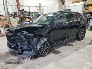2018 Mazda CX-5 Grand Touring with VIN JM3KFADM3J0325843, listed as a Copart auction lot 87958375 with 93,577 mi miles and Salvage title. Bid and sale history available at DreamBid. Image 1.