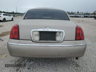 2000 Lincoln Town Car Signature с VIN 1LNHM82W1YY903645, выставлен на аукционе Copart как лот 55663175 с пробегом Не указан миль и Списание • Salvage title. История ставок и продаж доступна на DreamBid. Изображение 6.