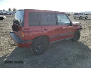 1995 Suzuki Sidekick z VIN JS3TD03V6S4113425, wystawiony jako Copart lot #76973244 z przebiegiem 152 638 mil mil oraz Szkody całkowita. Historia ofert i sprzedaży dostępna na DreamBid. Obrazek 3.