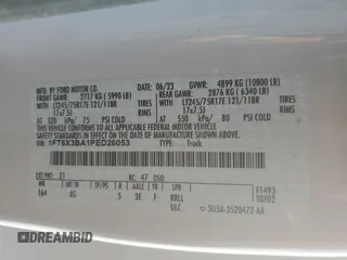 2023 Ford F-350 z VIN 1FT8X3BA1PED26053, wystawiony jako Copart lot #42484225 z przebiegiem 5 648 mil mil oraz Szkoda całkowita • Salvage title. Historia ofert i sprzedaży dostępna na DreamBid. Obrazek 13.