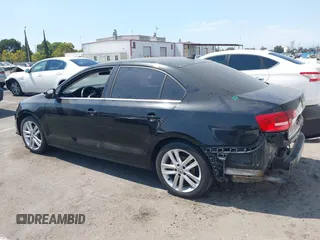 2015 Volkswagen Jetta SEL z VIN 3VWL17AJ7FM307632, wystawiony jako IAAI lot #42766536 z przebiegiem 101 661 mil mil oraz . Historia ofert i sprzedaży dostępna na DreamBid. Obrazek 14.